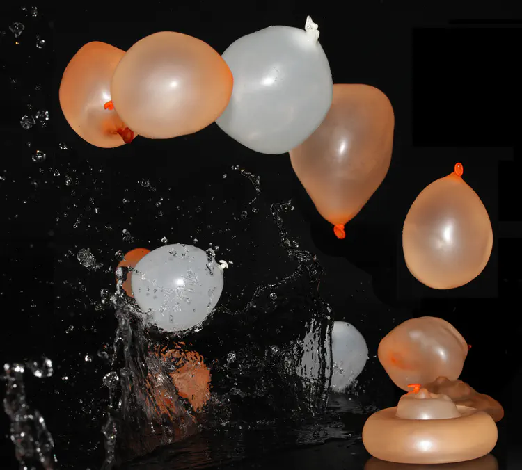 Deformation, bursting, and bouncing of water balloons